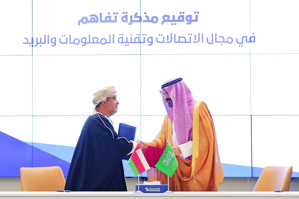 Said Hamoud Al Maawali, Minister of Transport, Communications and Information Technology, and Abdullah Amer Al Swaha, KSA Minister of Communication and Information Technology, after signing the MoU in Riyadh on Wednesday. 