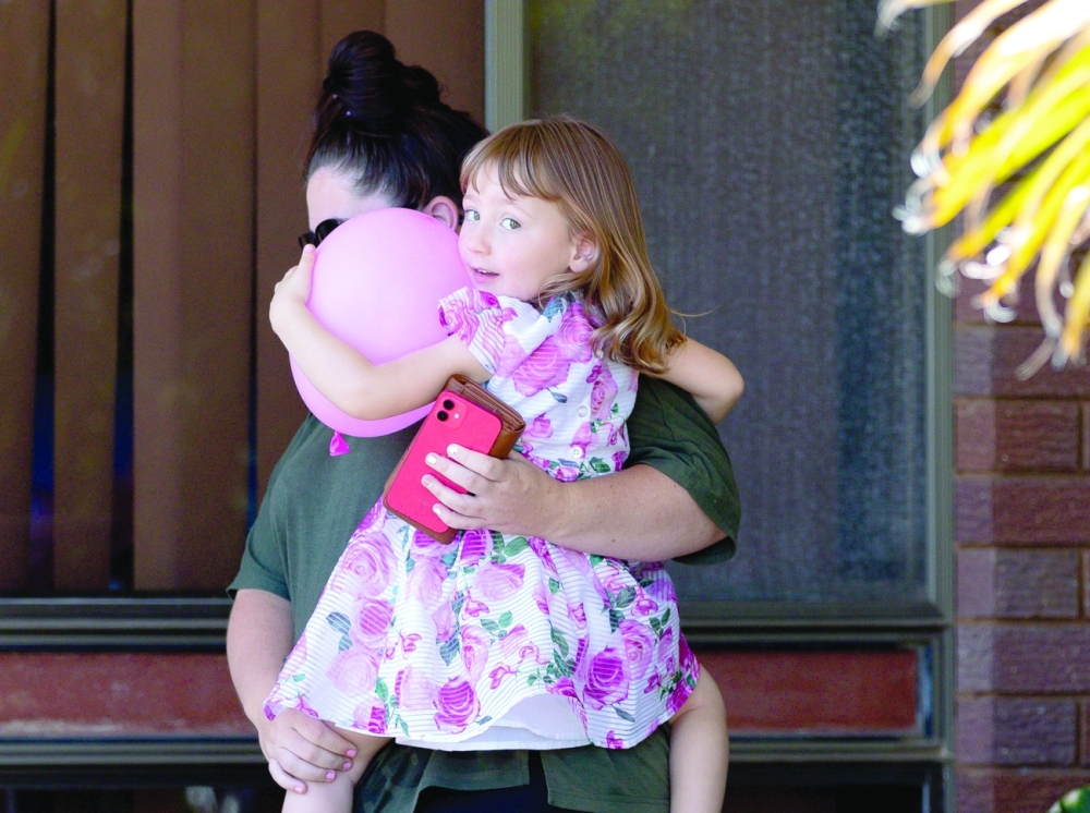 Cleo Smith and her mother Ellie Smith leave a house where the girl spent her first night after being rescued in Carnarvon, on Thursday. - Reuters