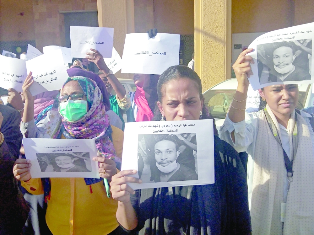 Sudanese rally to demand justice for those killed by security forces in protests, in central Khartoum on Thursday. - AFP