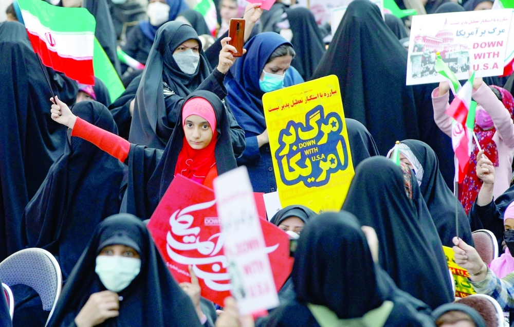 A girl waving a national flag takes part in a rally outside the former US embassy in Tehran on Thursday, to mark the 42th anniversary of the start of the Iran hostage crisis. - AFP