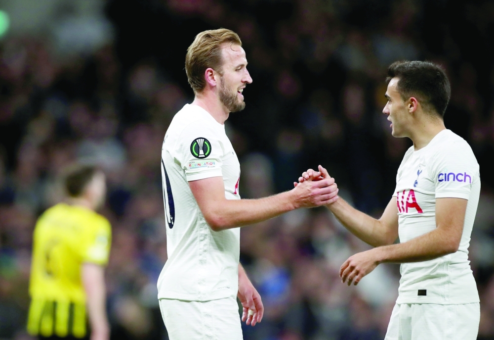 Tottenham Hotspur's Harry Kane and Sergio Reguilon celebrate after Vitesse Arnhem's Jacob Rasmussen scores an own goal. -- Reuters