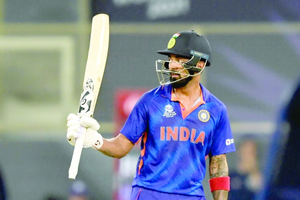 India's KL Rahul celebrates after scoring a half-century. -- AFP