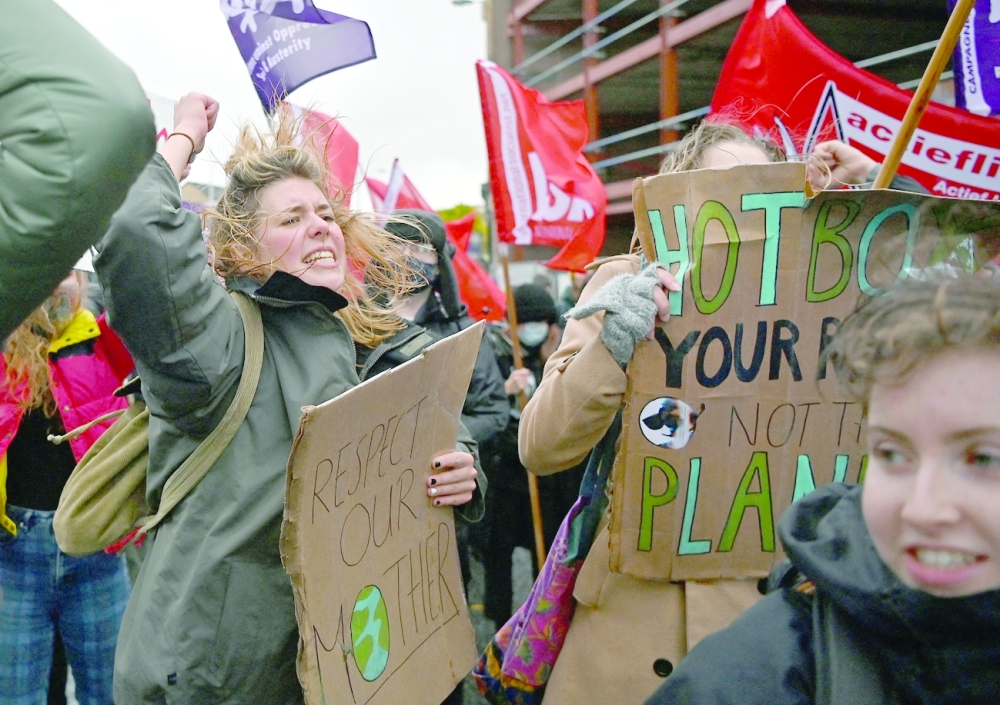 People participate in a protest rally in Glasgow on Saturday. - AFP