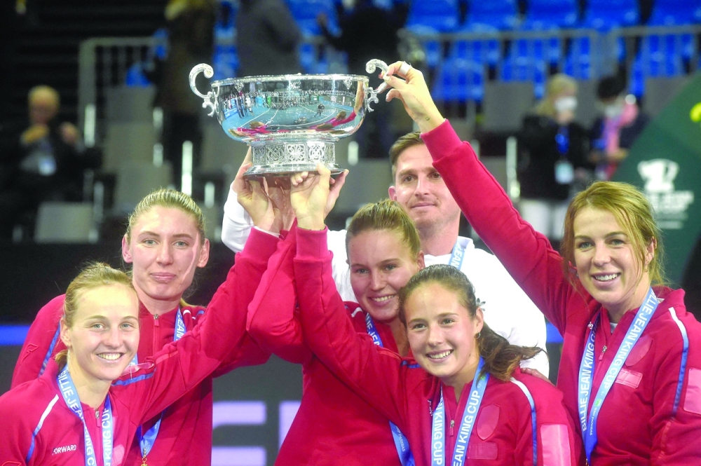 Team Russia celebrates with their trophy after winning the Billie Jean King Cup. -- AFP