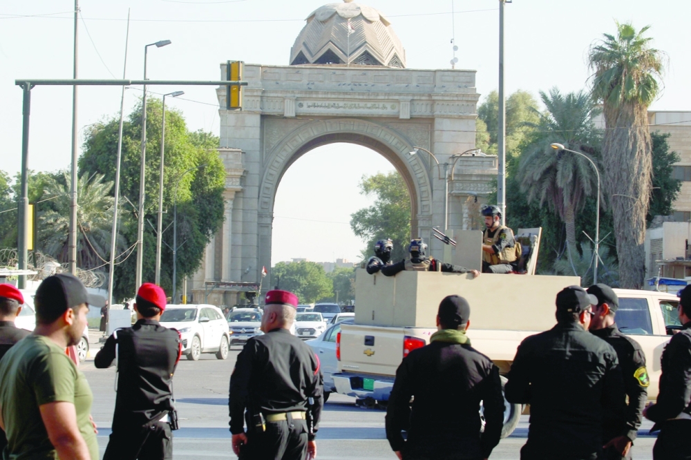 Iraqi security forces take part in a security deployment following the drone attack on PM residence at one of the fortified Green Zone entrances in Baghdad on Sunday. - Reuters