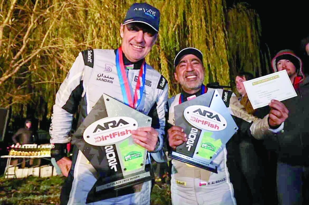 Hamed Al-Wahaibi and Tony Sircombe celebrate the RC2 class win and fourth overall.