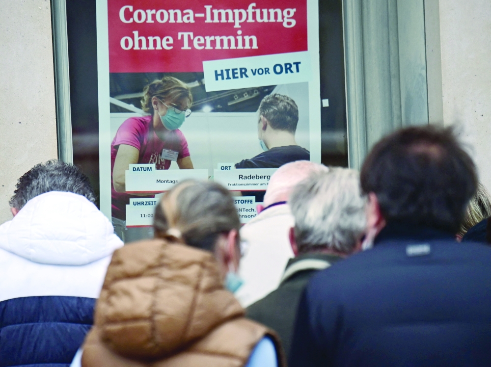 People queue in front of a vaccination centre in Radeberg, eastern Germany, to get a Covid vaccination without an appointment, on Monday. - AFP 