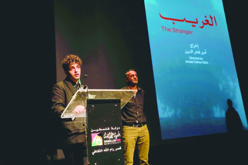 Palestinian director Ameer Fakher Eldin speaks during the opening of the Palestine Cinema Days festival, in Ramallah. - Reuters