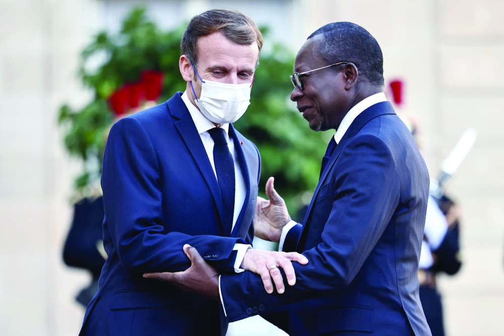 French President Emmanuel Macron with Benin's President Patrice Talon in Paris on Tuesday. -- Reuters