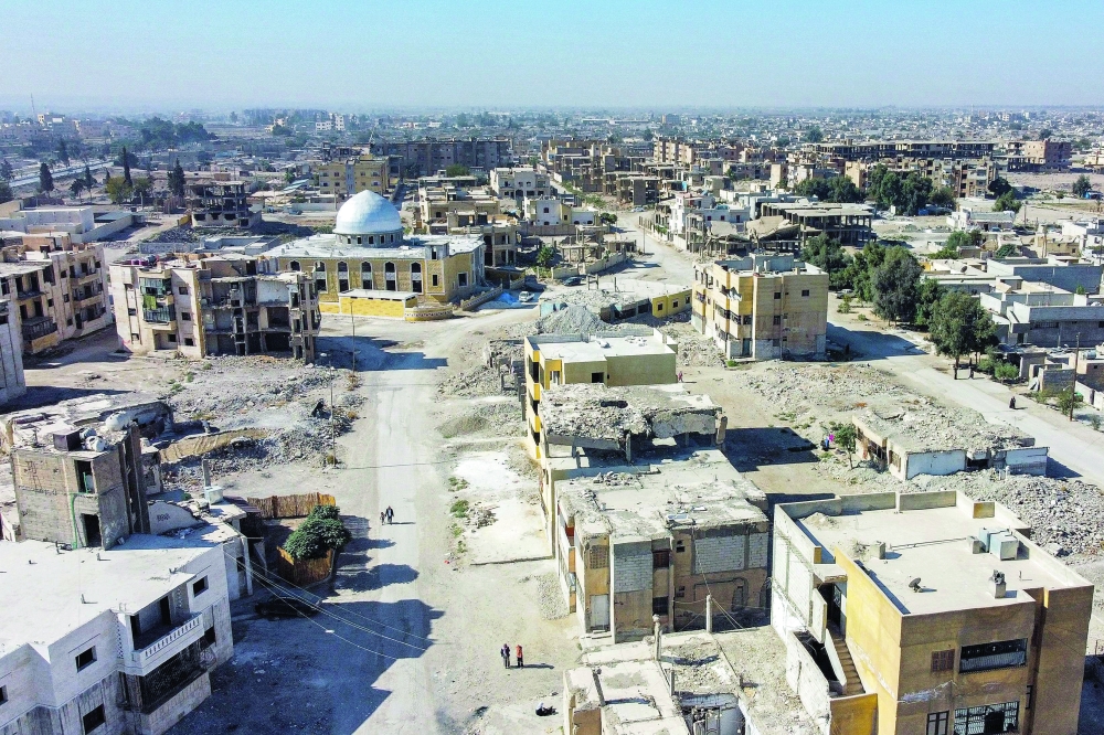 This picture shows an aerial view of destruction in Syria's northern city of Raqa. - AFP