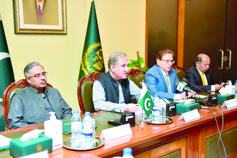 Pakistan's Foreign Minister Shah Mahmood Qureshi addresses the envoys from the United States, China and Russia during "Troika plus" group conference in Islamabad on Thursday. - Reuters 