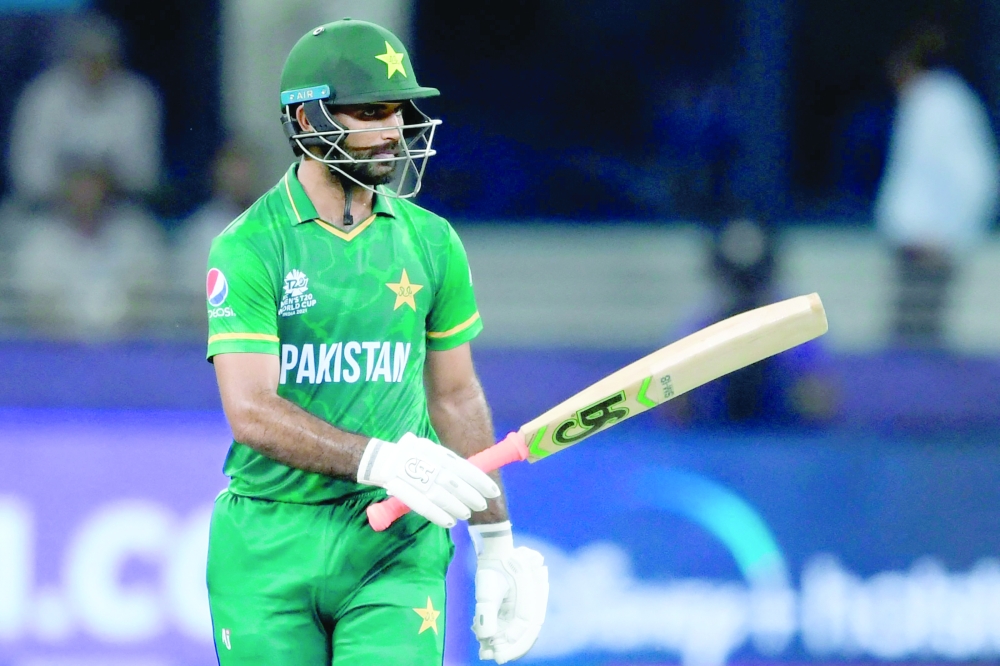 Pakistan’s Fakhar Zaman celebrates after scoring a half-century. — AFP