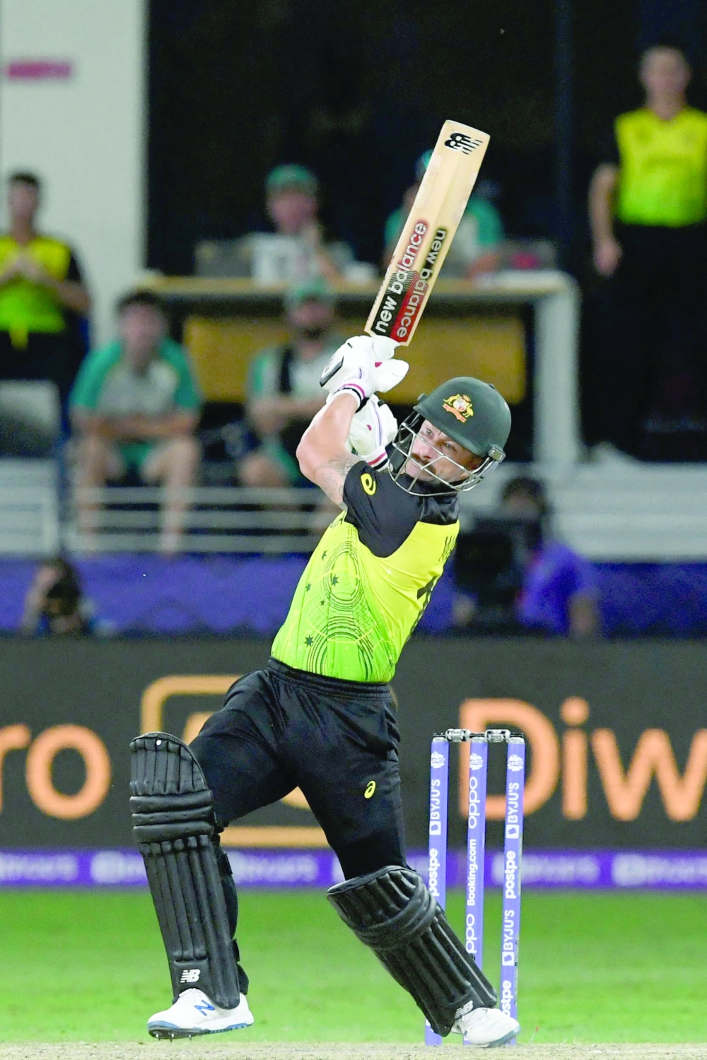 Australia’s Matthew Wade hits a boundary. — AFP