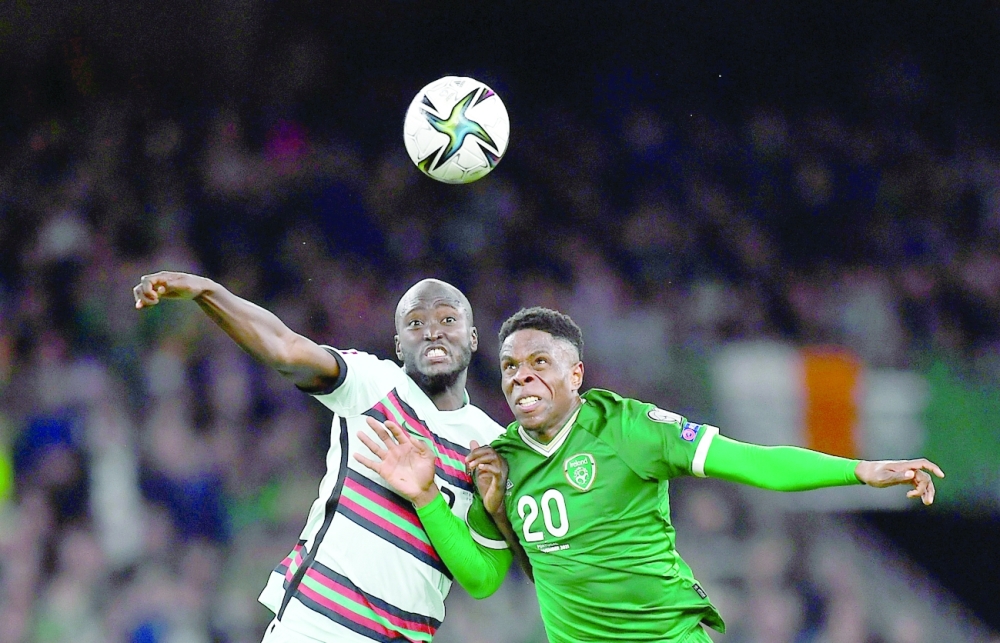 Portugal's Danilo Pereira in action with Republic of Ireland's Chiedozie Ogbene. -- Reuters