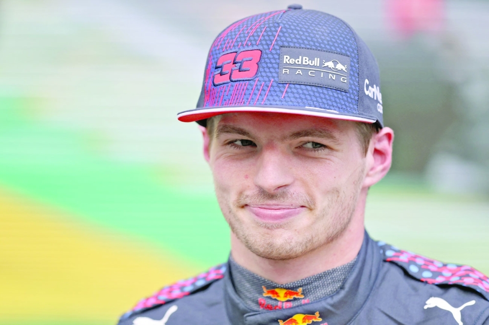 Red Bull's Max Verstappen smiles after taking the second place in the qualifying session for Brazil's Formula One Sao Paulo Grand Prix. -- AFP