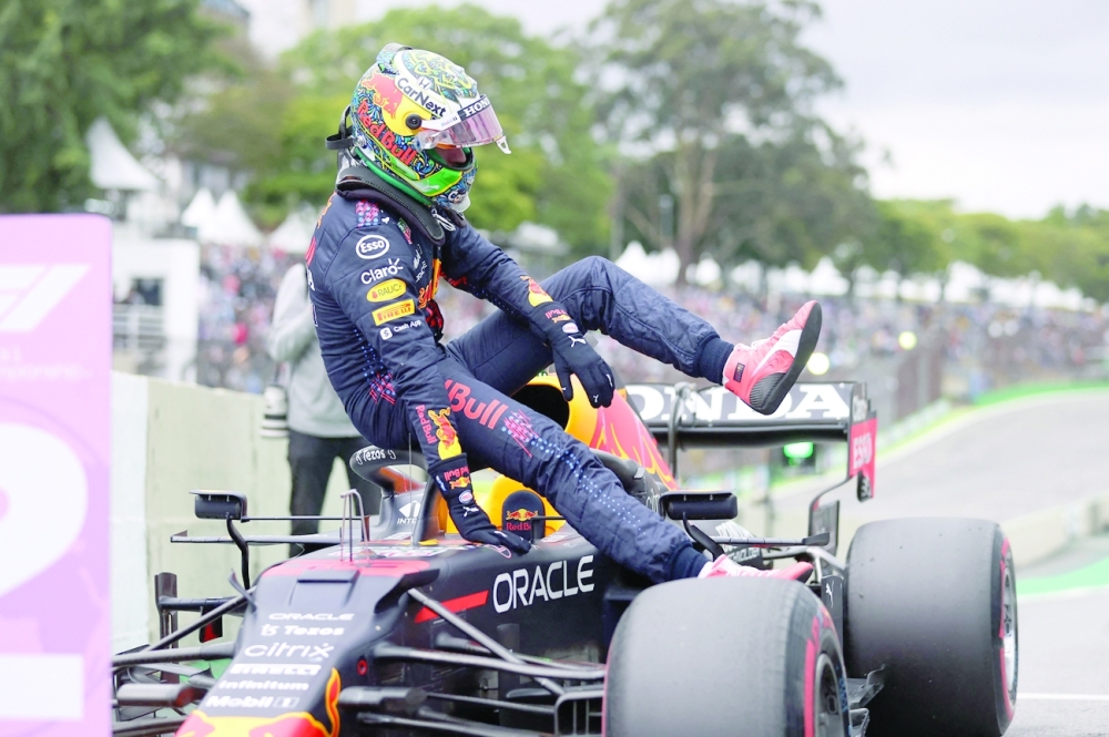 Red Bull's Max Verstappen gets out of his cockpit after taking the second place in the qualifying session for Brazil's Formula One Sao Paulo Grand Prix. -- AFP