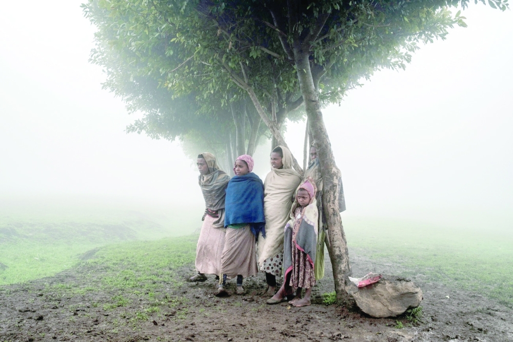 Children stand under a tree on the site of a future camp for Eritrean refugees, in a rural area near the village of Dabat, 70 kilometres northeast from the city of Gondar, Ethiopia. 