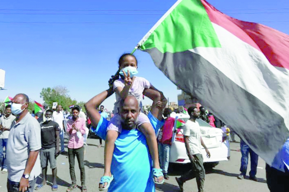 Anti-coup protesters take part in a demonstration in the capital Khartoum on Saturday, two days after the military sought to tighten its grip by forming a new ruling council. -- AFP 