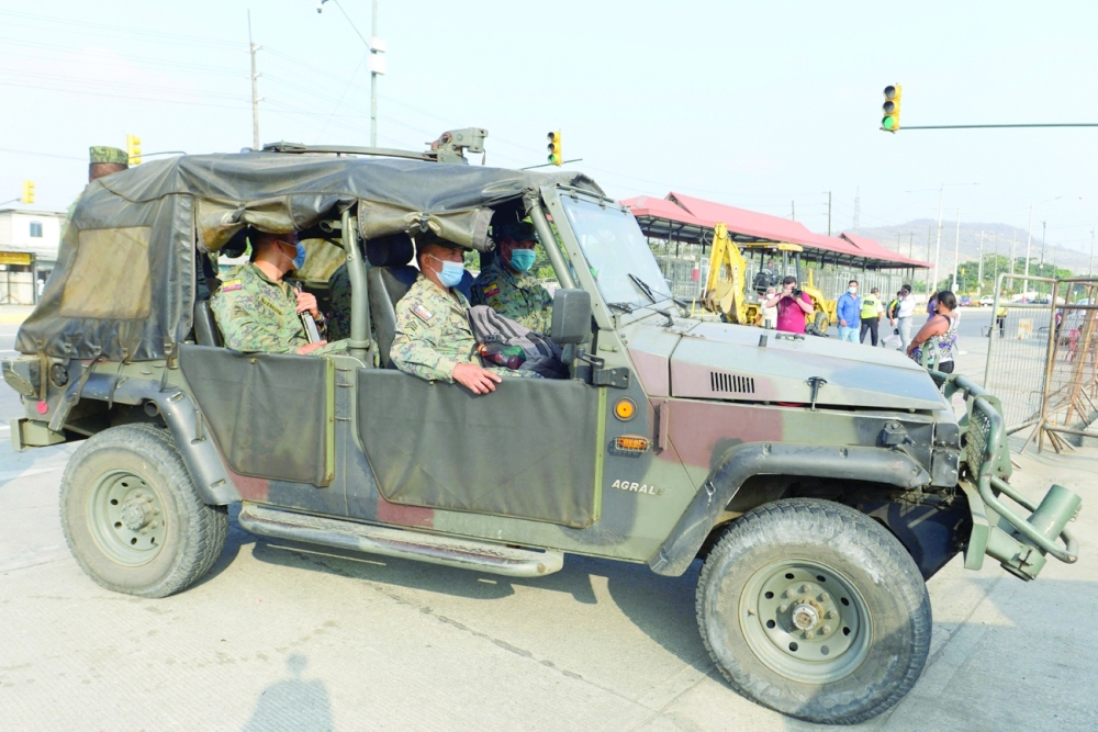 A military vehicle senters the Guayas 1 prison in Guayaquil, Ecuador. - AFP