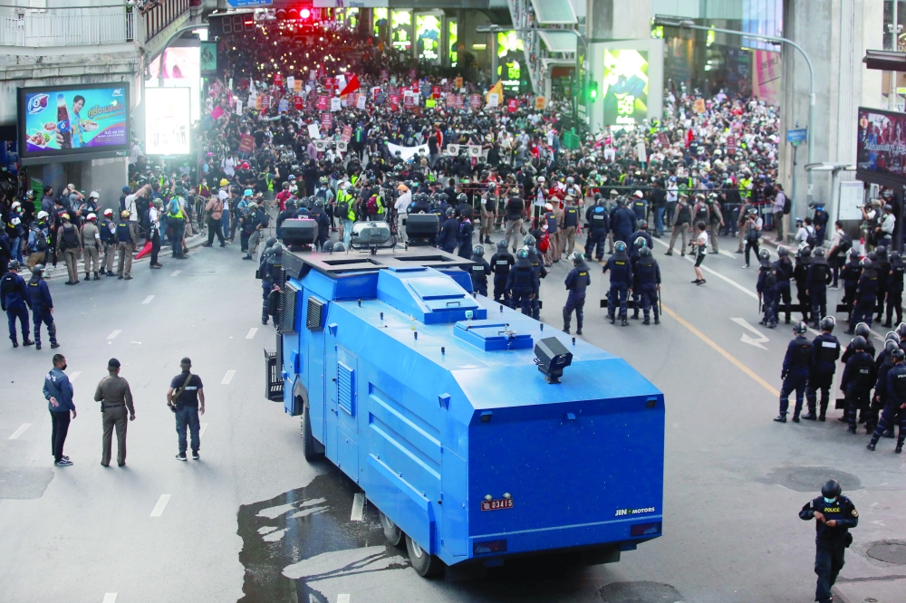 Police block demonstrators during a protest against the amendment of the lese majeste law, in Bangkok. - Reuters
