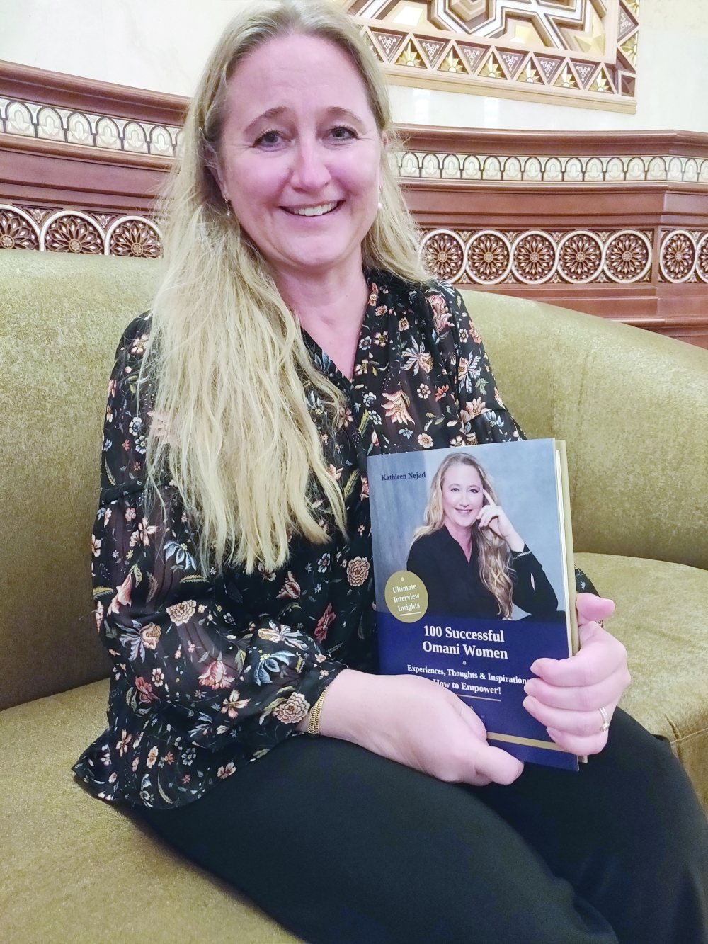 Kathleen Nejad with her book