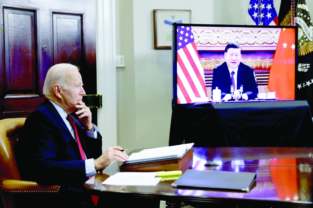 US President Joe Biden speaks virtually with Chinese leader Xi Jinping from the White House in Washington, on Monday. — Reuters