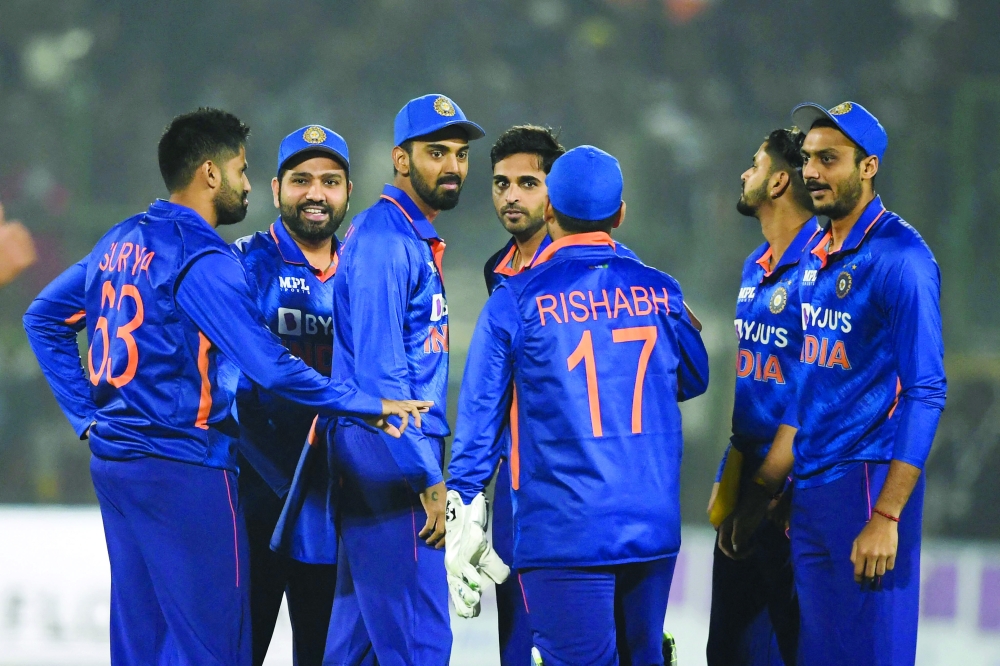 Indian cricketers celebrate after the dismissal of New Zealand's Mitchell Santner (not pictured) during the first T20I against New Zealand at the Sawai Mansingh stadium in Jaipur. -- AFP

