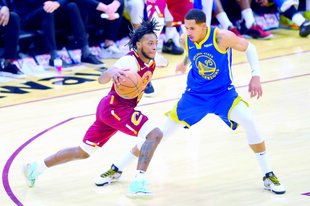 Cleveland Cavaliers guard Darius Garland (10) drives against Golden State Warriors forward Juan Toscano-Anderson (95) in the fourth quarter at Rocket Mortgage FieldHouse. -- USA Today Sports
