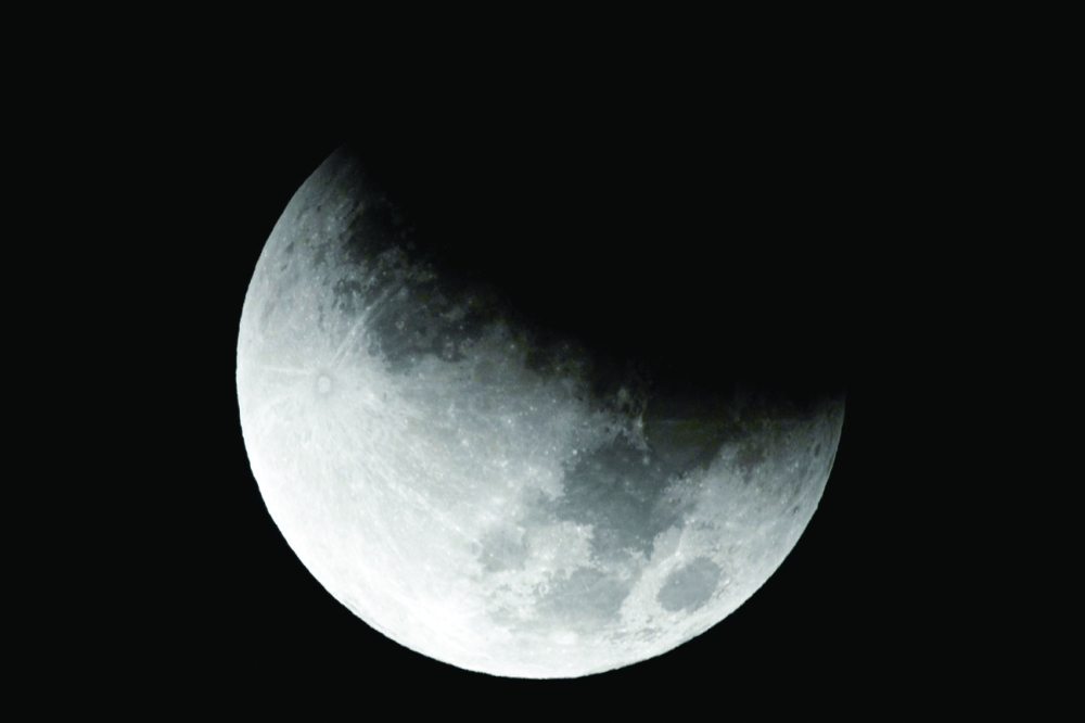 The Beaver 'blood' Moon partial lunar eclipse is seen in Washington on Friday. — Reuters
