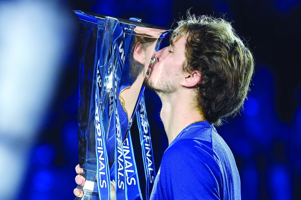 Germany's Alexander Zverev celebrates with the trophy. -- AFP