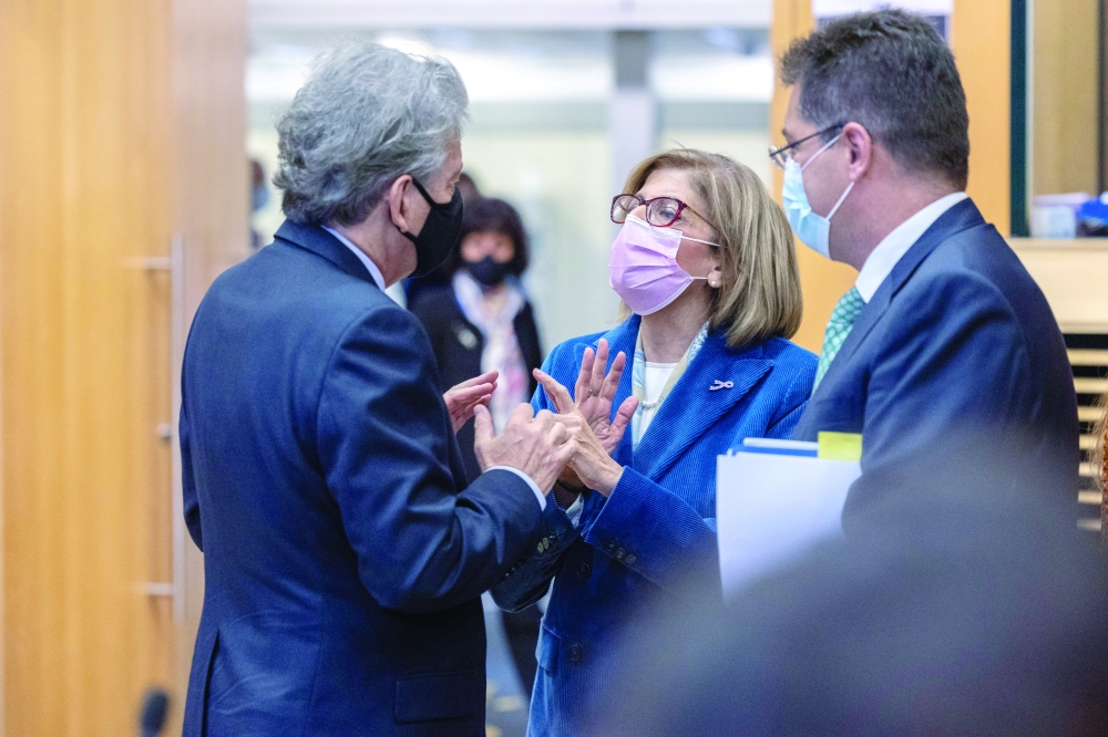 European Commissioner for Internal Market Thierry Breton speaks with Commissioner for Health and Food Safety Stella Kyriakides before the College of Commissioners meeting at the European Commission in Brussels. - Reuters