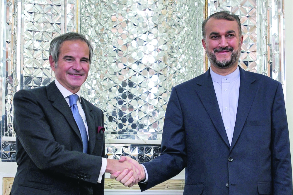 Iran's Foreign Minister Hossein Amir Abdollahian with the Director-General, International Atomic Energy Agency (IAEA) Rafael Grossi at the foreign ministry headquarters in Tehran. - AFP 

