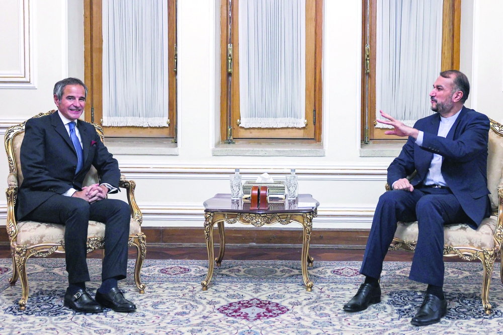Iran's Foreign Minister Hossein Amir-Abdollahian with the Director-General of the International Atomic Energy Agency (IAEA) Rafael Grossi at the foreign ministry headquarters in Tehran. - AFP

