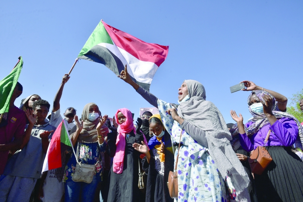 Sudanese protesters gather in the busy Jabra district of southern Khartoum on Thursday. - AFP 