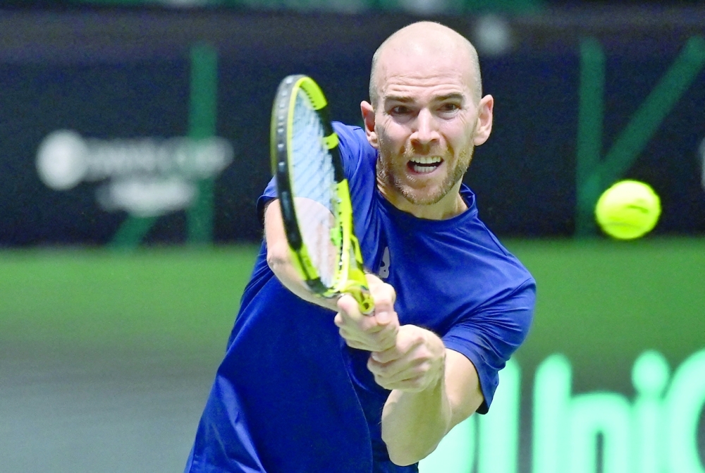 France's Adrian Mannarino returns the ball to Jiri Vesely of Czech Republic (not pictured). -- AFP