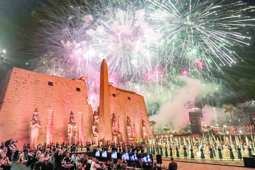 Fireworks light the sky during the official ceremony opening the "Rams Road" outside the pylon and remaining obelisk at the entrance of the Temple of Luxor on Thursday. - AFP 