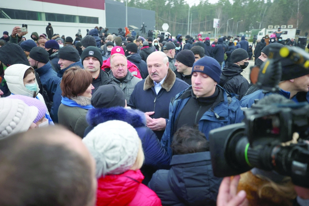 Belarus's President Alexander Lukashenko visits a centre for migrants, near the Bruzgi border point on the Belarusian-Polish border in the Grodno region on Friday. - AFP