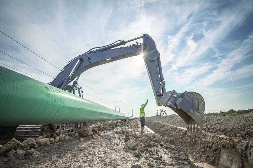 A worker operates a bulldozer for Enbridge Inc's oil pipeline replacement project in North Dakota. — Reuters