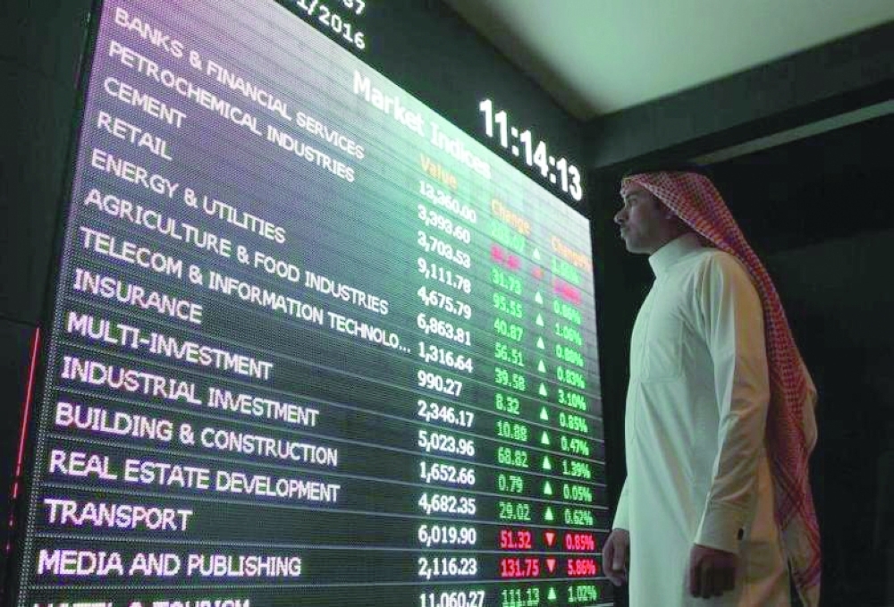 An man monitors a screen displaying stock information at the Saudi Stock Exchange (Tadawul) in Riyadh, Saudi Arabia, in this file photo. — Reuters 