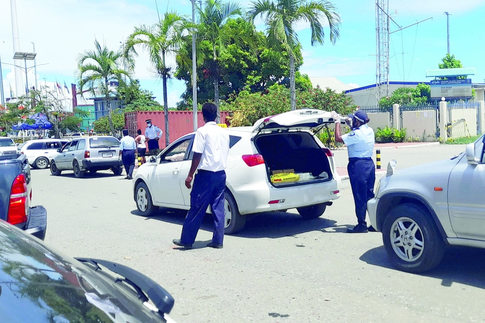 Police man a checkpoint in Honiara as the Red Cross warned of food shortages in the Solomon Islands capital following three days of rioting. - AFP

