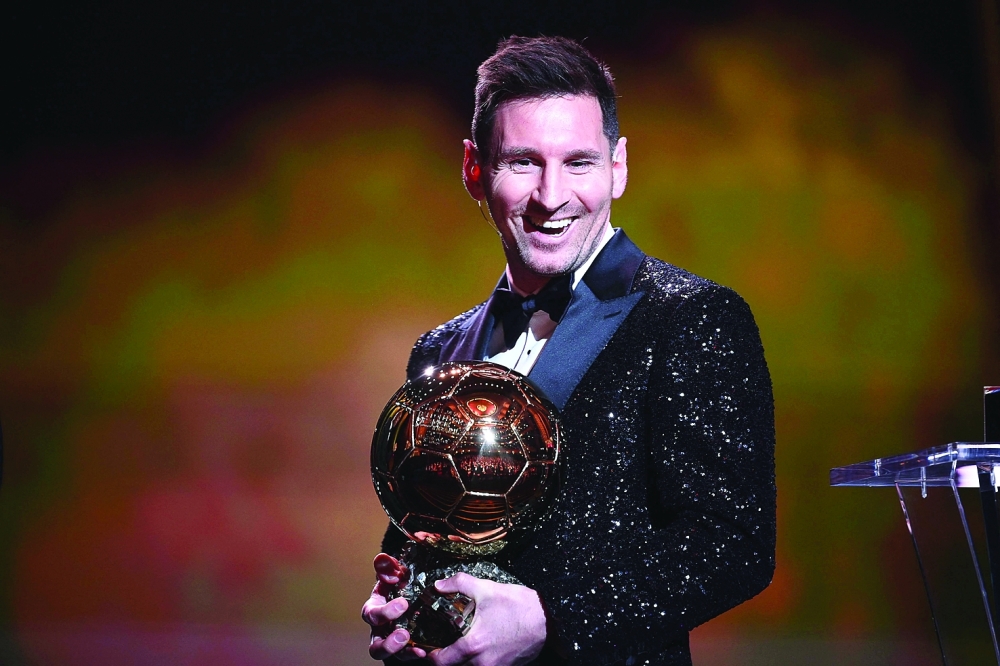 Lionel Messi reacts after being awarded the the Ballon d'Or award during the 2021 Ballon d'Or France Football award ceremony at the Theatre du Chatelet in Paris. -- AFP