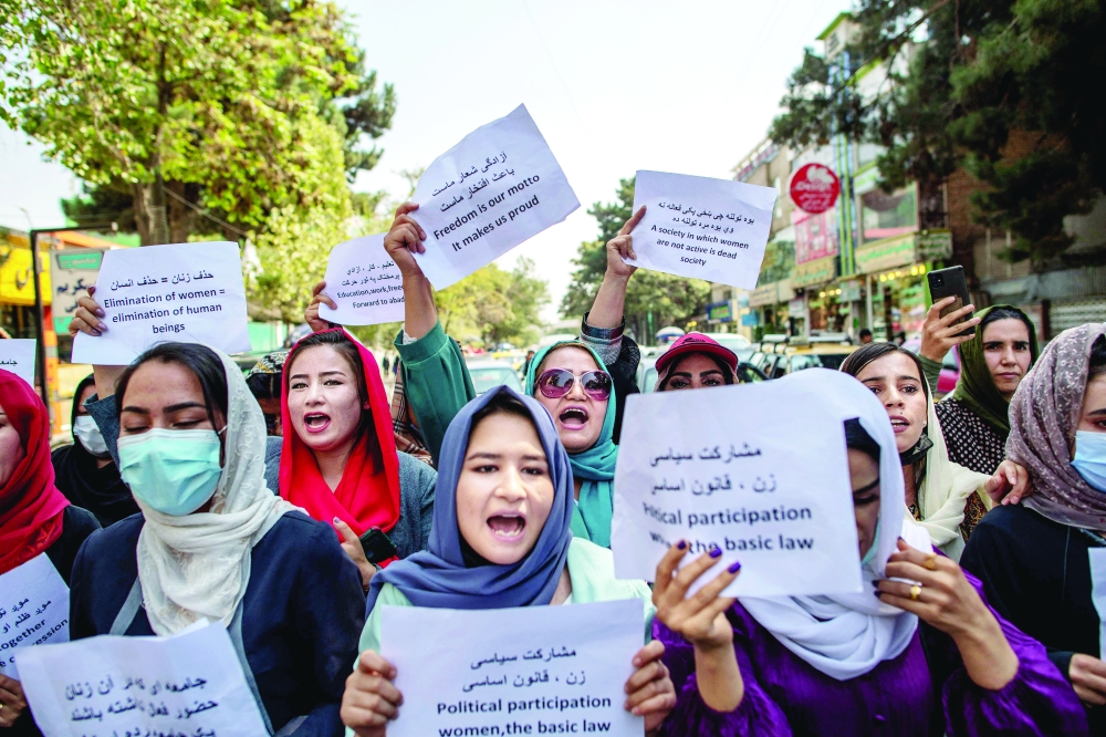 Afghan women during a demonstration demanding better rights for women in front of the former Ministry of Women Affairs in Kabul. - AFP File