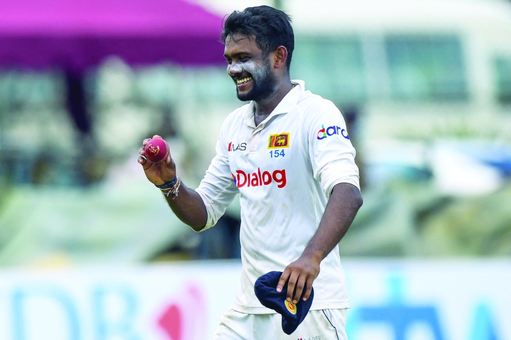 Sri Lanka’s Ramesh Mendis shows the ball as he leaves the field at the end West Indies’ first innings during the third day of the second Test. — AFP