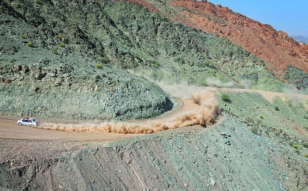 Zakariah Al-Aufi crosses classic Oman terrain.