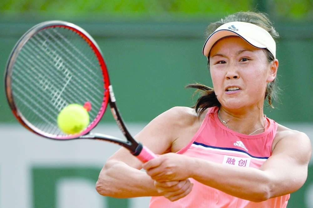 This file photo taken on May 29, 2018 shows China's Peng Shuai hitting a return against Serbia's Aleksandra Krunic during their women's singles first round match at the French Open. -- AFP