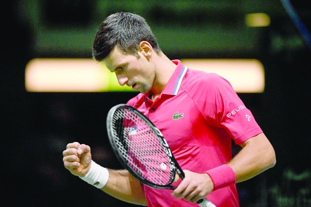 Serbia's Novak Djokovic reacts during the men's singles quarterfinal against Kazakhstan in the Davis Cup. -- AFP