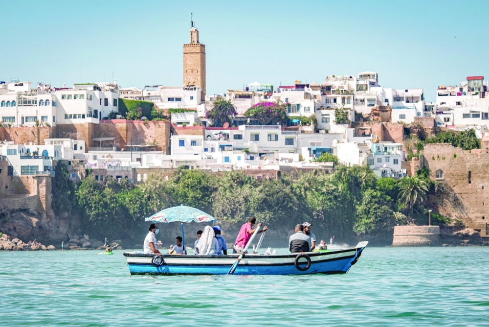 A boatman transporting passengers across the Bou Regreg river near the Oudaya Kasbah between the city of Sale and Morocco's capital Rabat. - AFP  