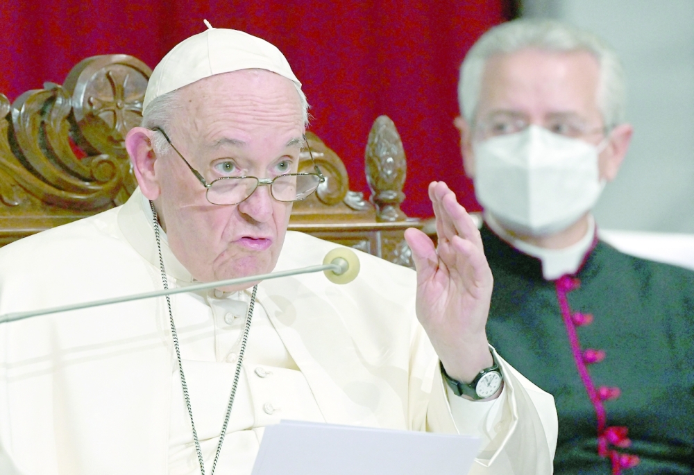 Pope Francis speaks during an ecumenical prayer with migrants at the Roman Catholic church of the Holy Cross near the United Nations buffer zone in the Cypriot city of Nicosia, Europe's last divided capital, on December 3, 2021. Pope Francis appealed for a "sense of fraternity" in an open-air mass in Cyprus on Friday, the second day of a visit to the divided Mediterranean island that has focused heavily on the plight of migrants. (Photo by ANDREAS SOLARO / AFP)
