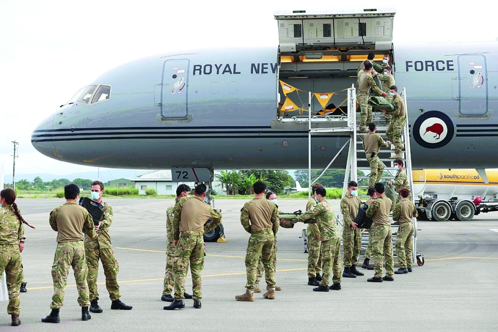 New Zealand Defence Force soldiers arrive in Honiara to join an international peacekeeping mission in Solomon Islands following deadly anti-government riots. - AFP 