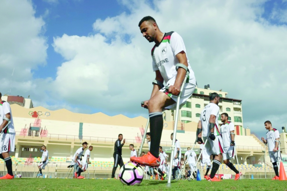 Palestinian players with disabilities take part in a training session in Gaza City. - AFP